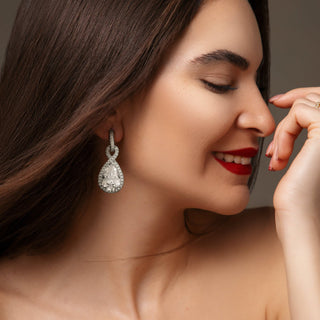 Woman wearing Diamaura earrings