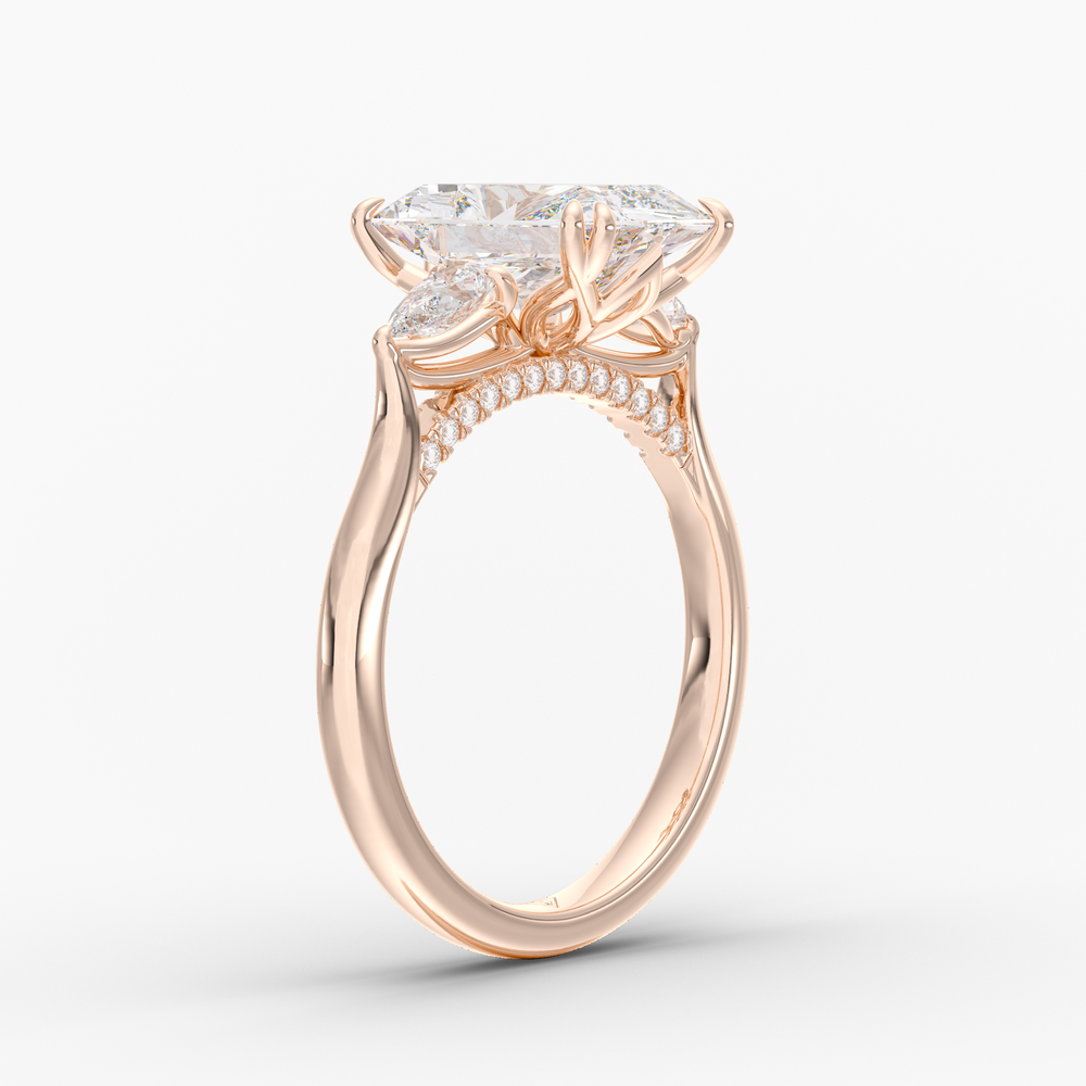 Aurelian Radiant engagement ring setting in 18K rose gold, three-quarter view.