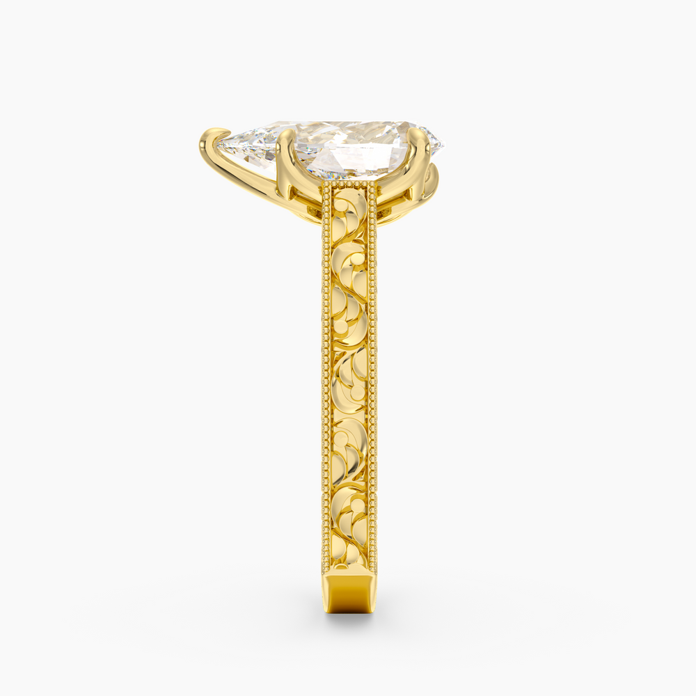 Florent Pear engagement ring setting in 18K yellow gold, side view.