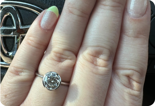 Diamond engagement ring on hand