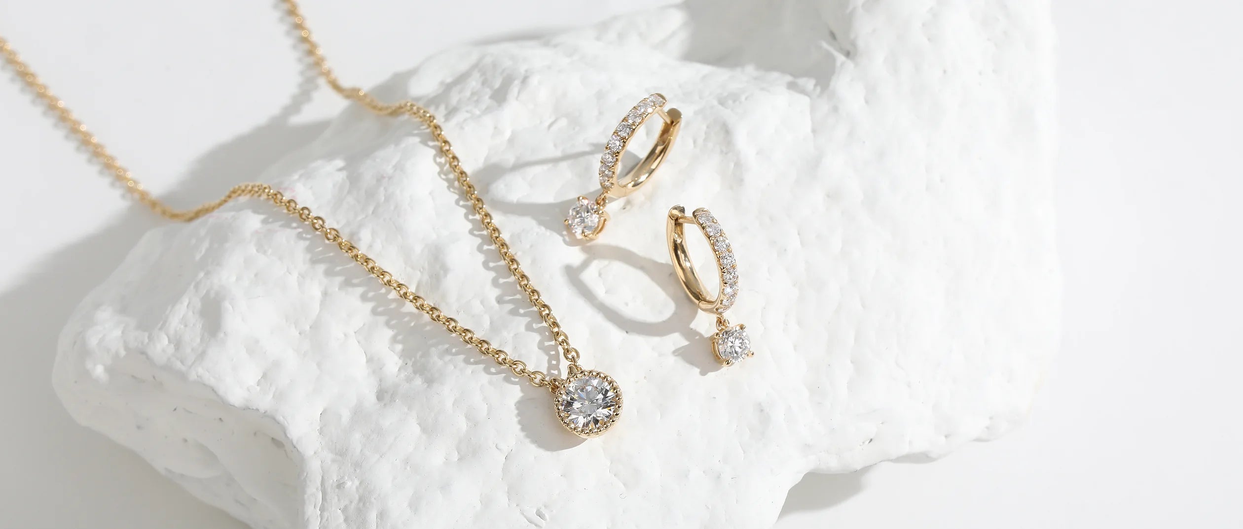 Yellow gold diamond necklace and drop earrings
